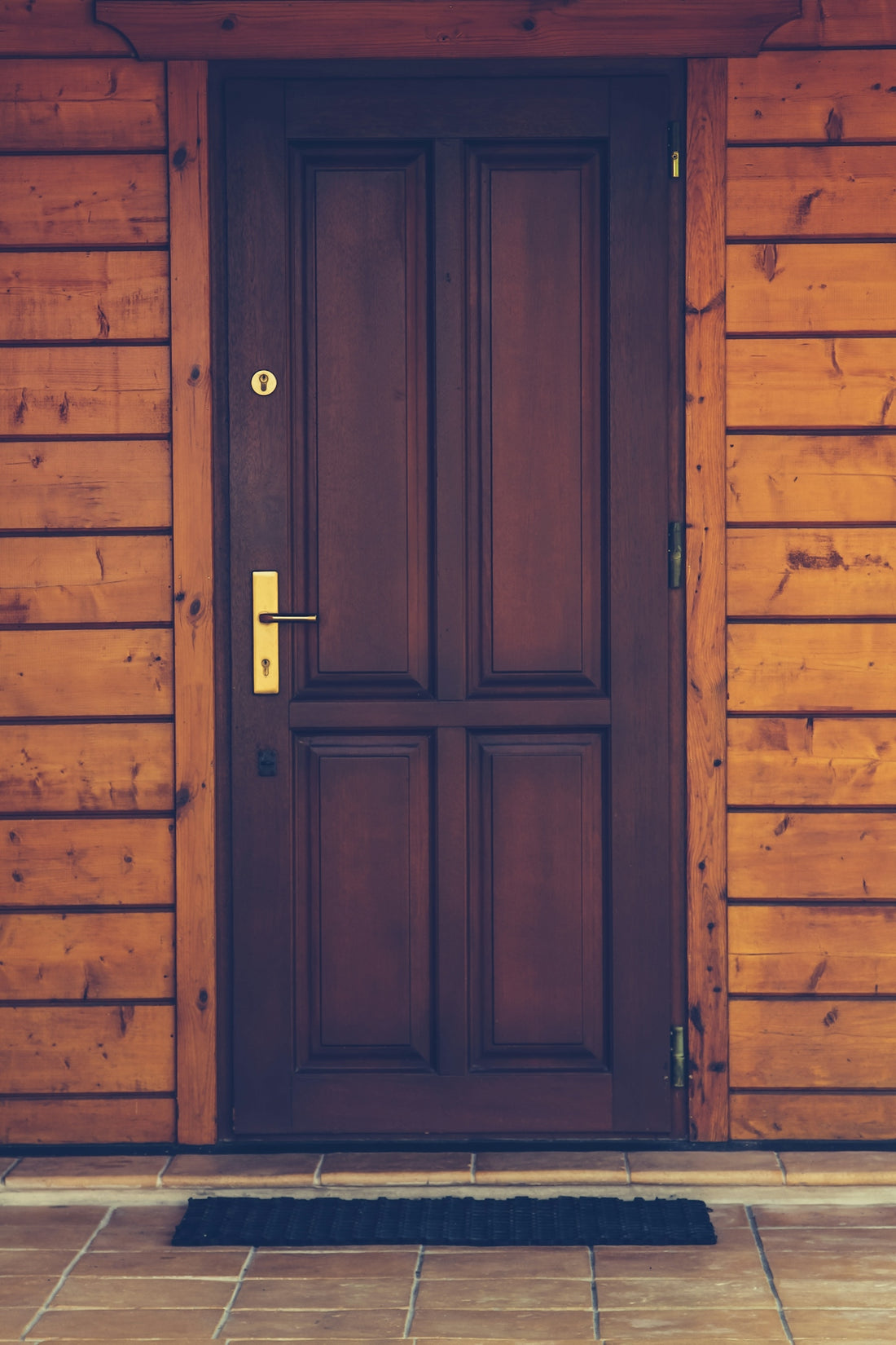 black wooden 4-panel door closed