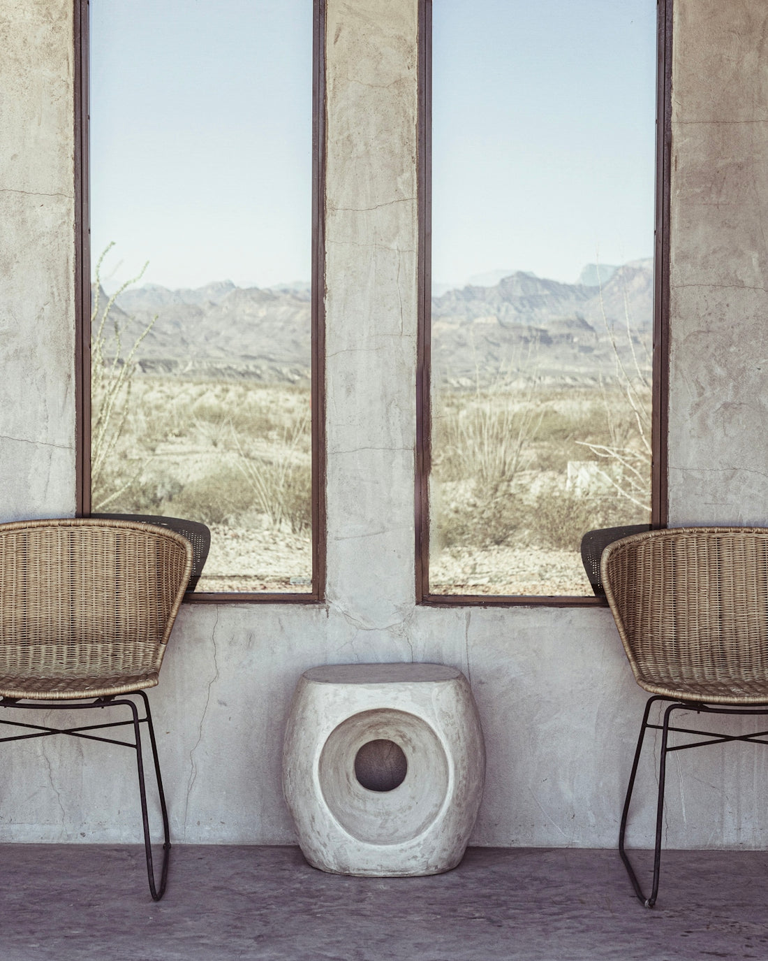 a couple of chairs sitting next to a window