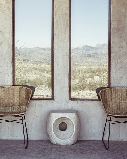 a couple of chairs sitting next to a window