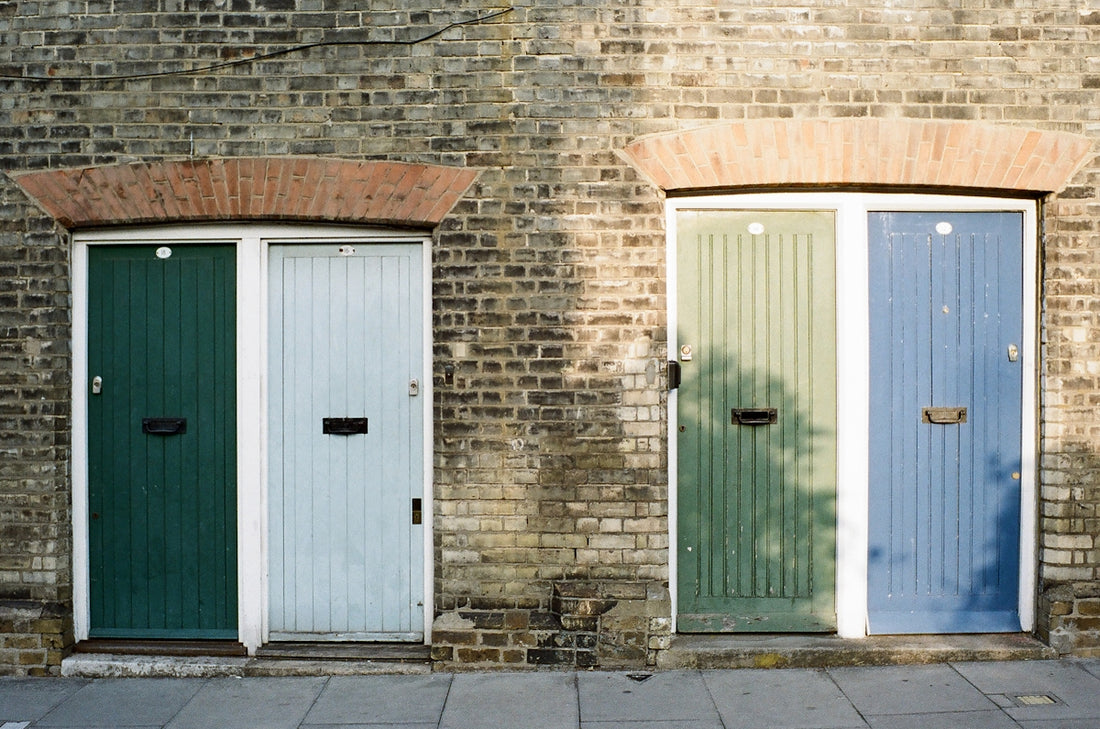 a row of doors on a brick building