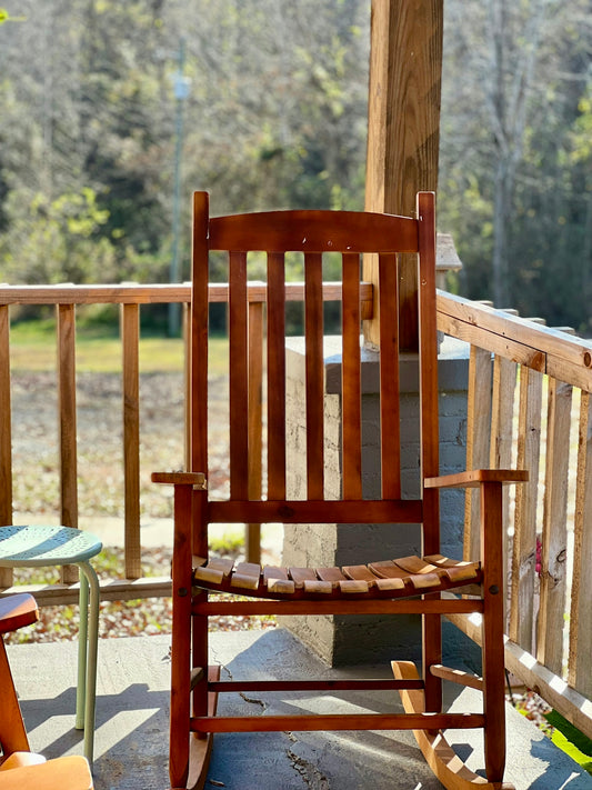 a wooden chair on a deck