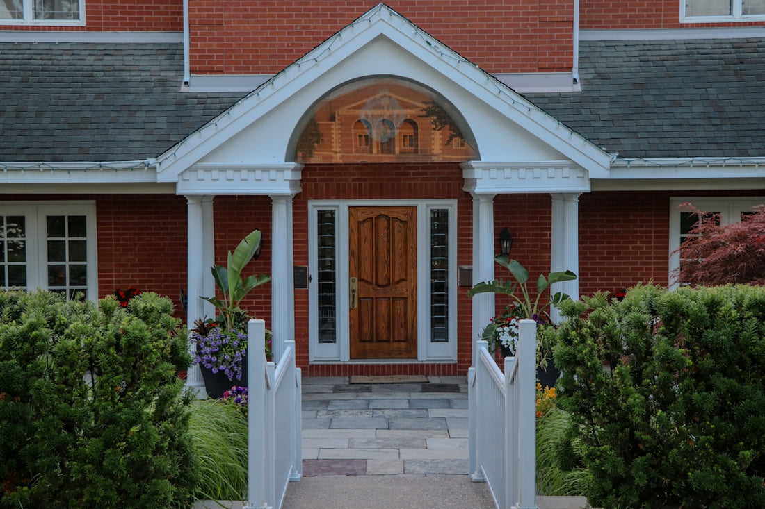 Elegant front entrance of a red brick house.